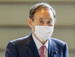 Japanese Prime Minister Yoshihide Suga arrives at his office in Tokyo on Oct. 16, 2020, wearing a mask amid continued worries about the novel coronavirus. (Photo by Kyodo News via Getty Images)